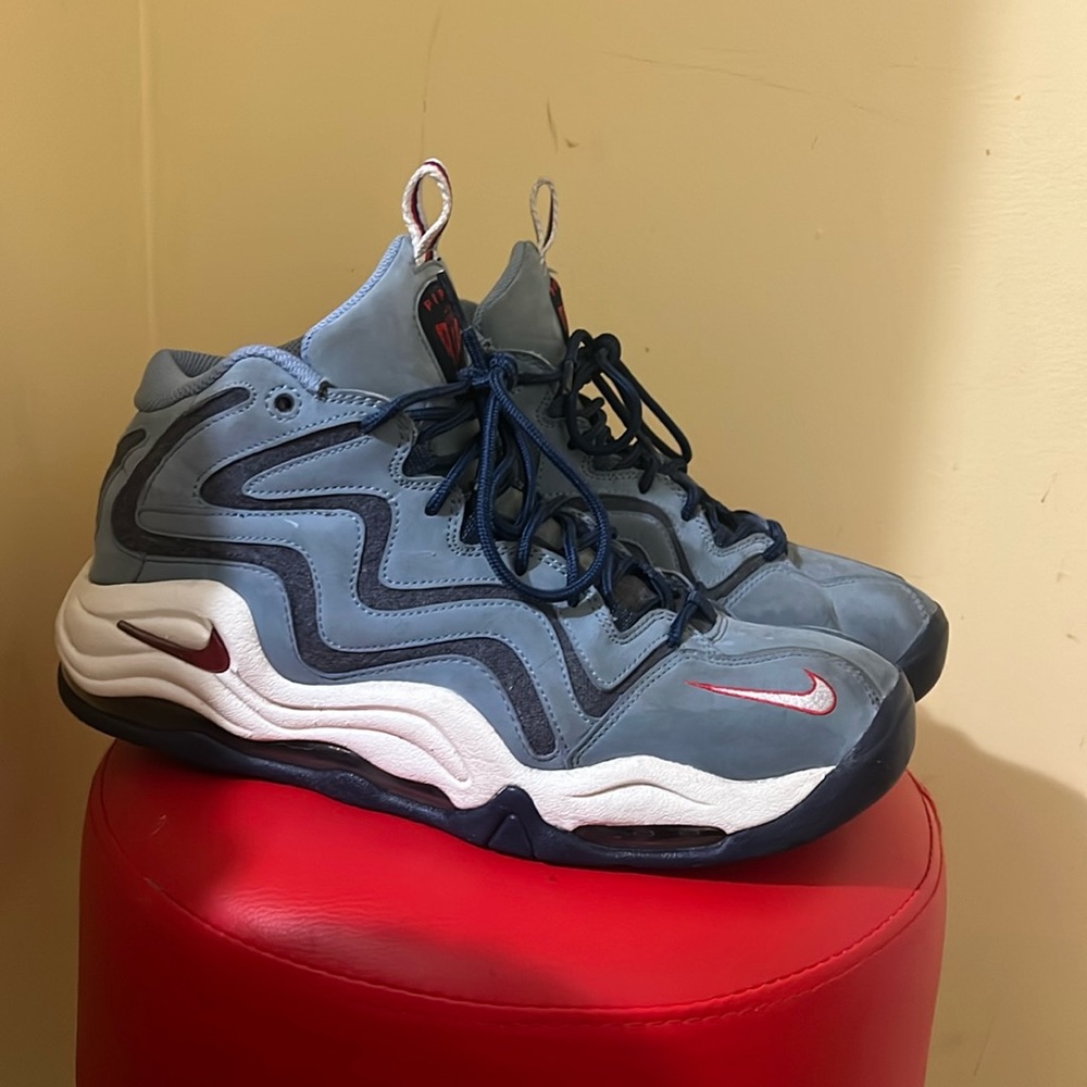 Blue white and red sneakers